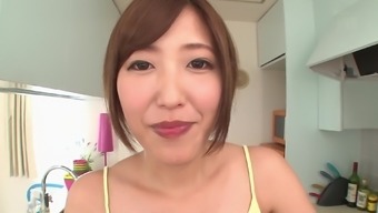 Asahi Mizuno cannot wait to ride a guy's hard cock in a kitchen