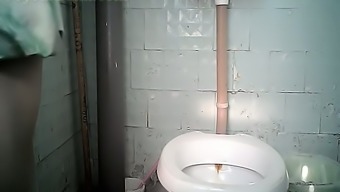 Chunky white slut climbs on a shitter to piss and gets filmed on cam