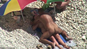 Tanned man fucks his wife on a nudist beach. Spy video