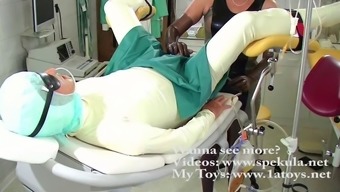Kinky couple in latex suits fuck at the doctor's office