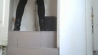 White amateur chick in high heel boots pisses in the toilet
