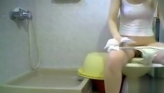 This girl is caught in the bathroom on hidden cam