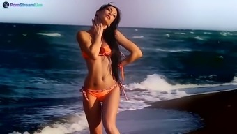 Smoking hot babe in bikini Mya Diamond gets naked and poses on the sand