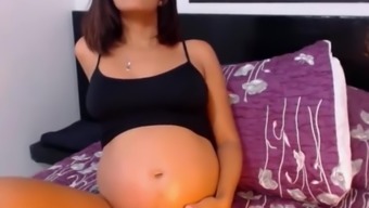 beautiful pregnant latina with wonderful belly and contractions