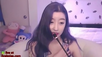 Korean sexy camgirl plays with her pantyhose