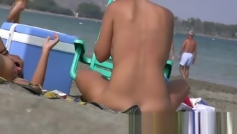 Having fun posing on public nudist beach voyeur hidden cam