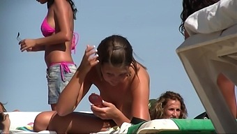 Topless teen on the beach 3