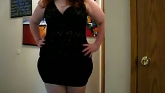 This sexy BBW looks very tempting in her dress and I love to watch her strip