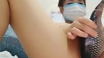 Chinese girl inserts fish into her vagina and squirts