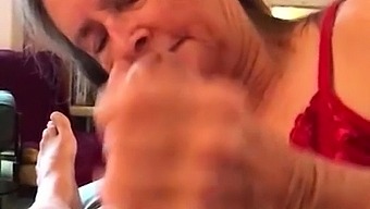 Amateur granny working her lips and hands on a thick cock