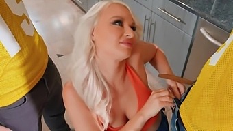 Blonde with round tits sucks two cocks but gets penetrated by one