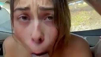 Teen slut works her mouth on the BBC in a car in a public parking lot