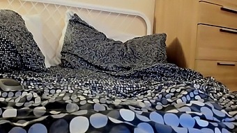 Cleaning up the bed after she pumps herself full of dildo cum