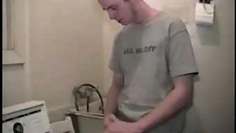 This guy from next door spreads his new porn magazine on the washing machine and pulls his cock out from under the fly of his baggy shorts without even letting his balls play.