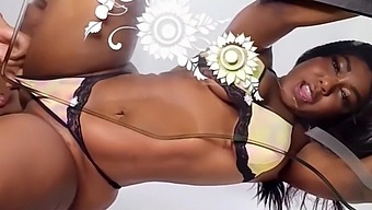 Amateur Colombian ebony gets her big natural tits fingered on a glass table
