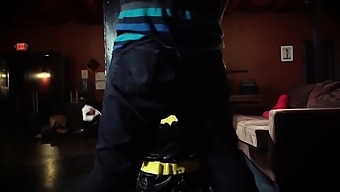 Latex-clad superheroine Batgirl seduced and dominated