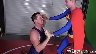 Gay bottom gets a face full of cum from a muscular wrestler