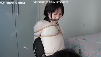 Chinese bondage with a gag-happy brunette